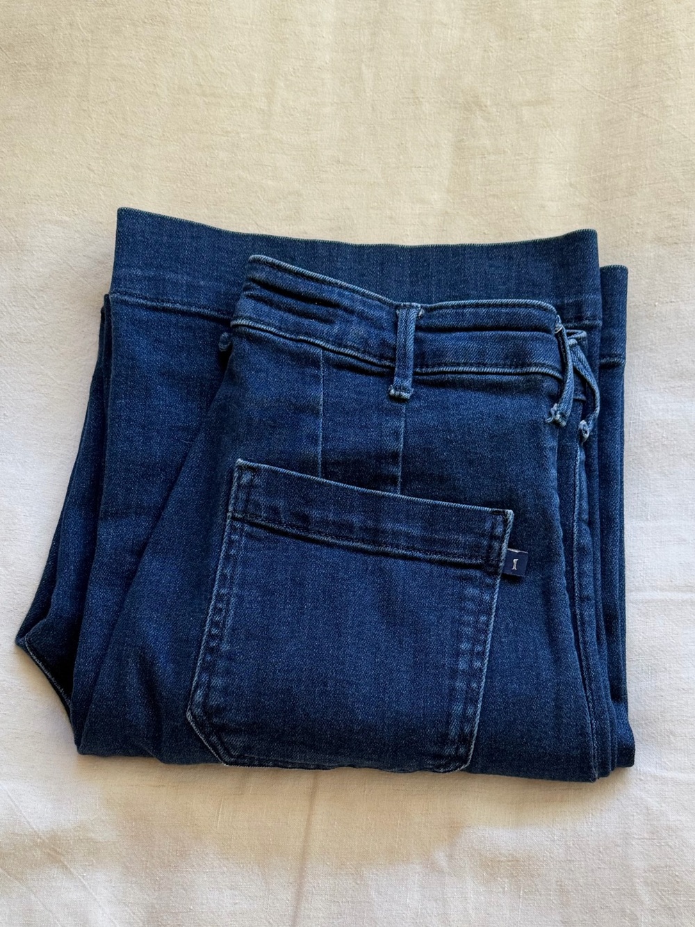 Pilcro navy blue denim jeans with tan leather label